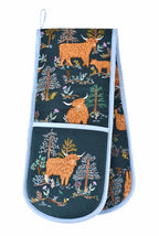 Ulster Weavers Connie the Cow double oven glove with Highland cows and trees on dark green with blue binding