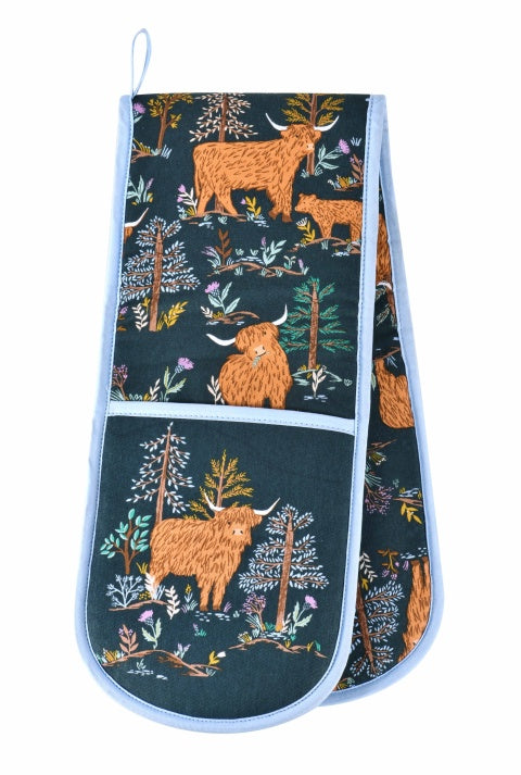 Ulster Weavers Connie the Cow double oven glove with Highland cows and trees on dark green with blue binding