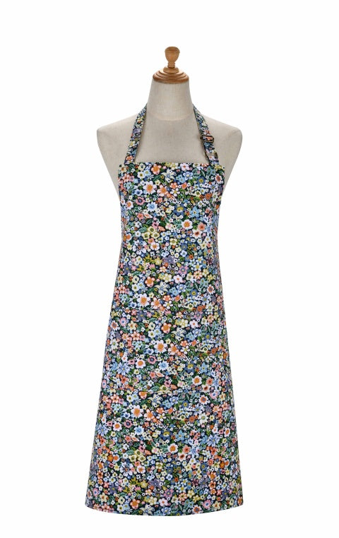 Ulster Weavers Confetti Floral cotton apron with small multicoloured flowers on dark blue, shown on a mannequin