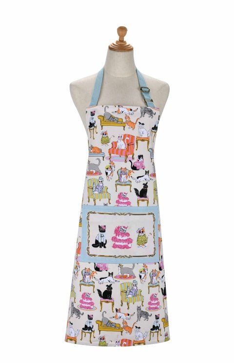 Ulster Weavers Cool Cats cotton apron with cats on chairs and sofas, a pocket and light blue straps, shown on a mannequin