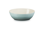 Le Creuset stoneware oval serving bowl in sea salt blue-green with a ridged exterior