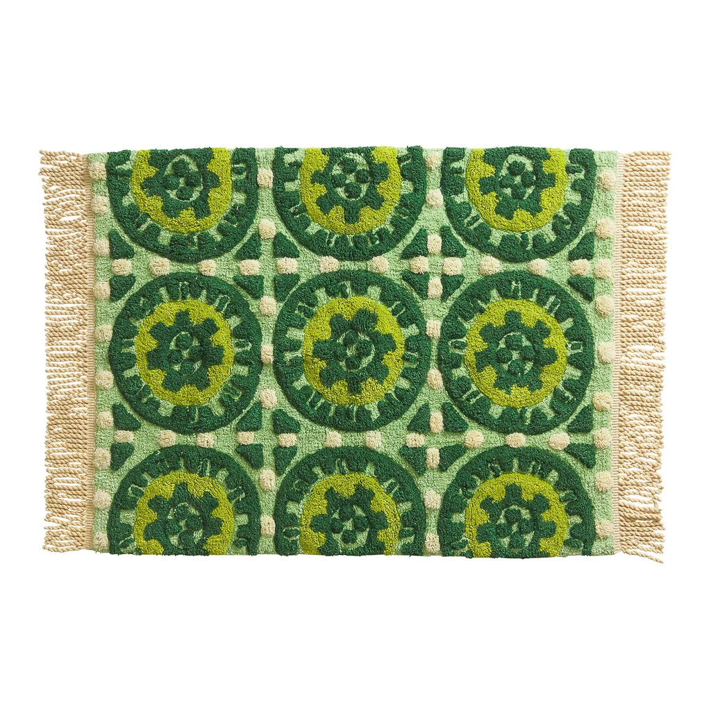 Sage x Clare Gabriella bath mat with a green tile-pattern print and fringed edges