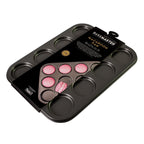 Bakemaster 12 cup macaroon pan in dark non-stick steel, shown in its packaging with pink macarons