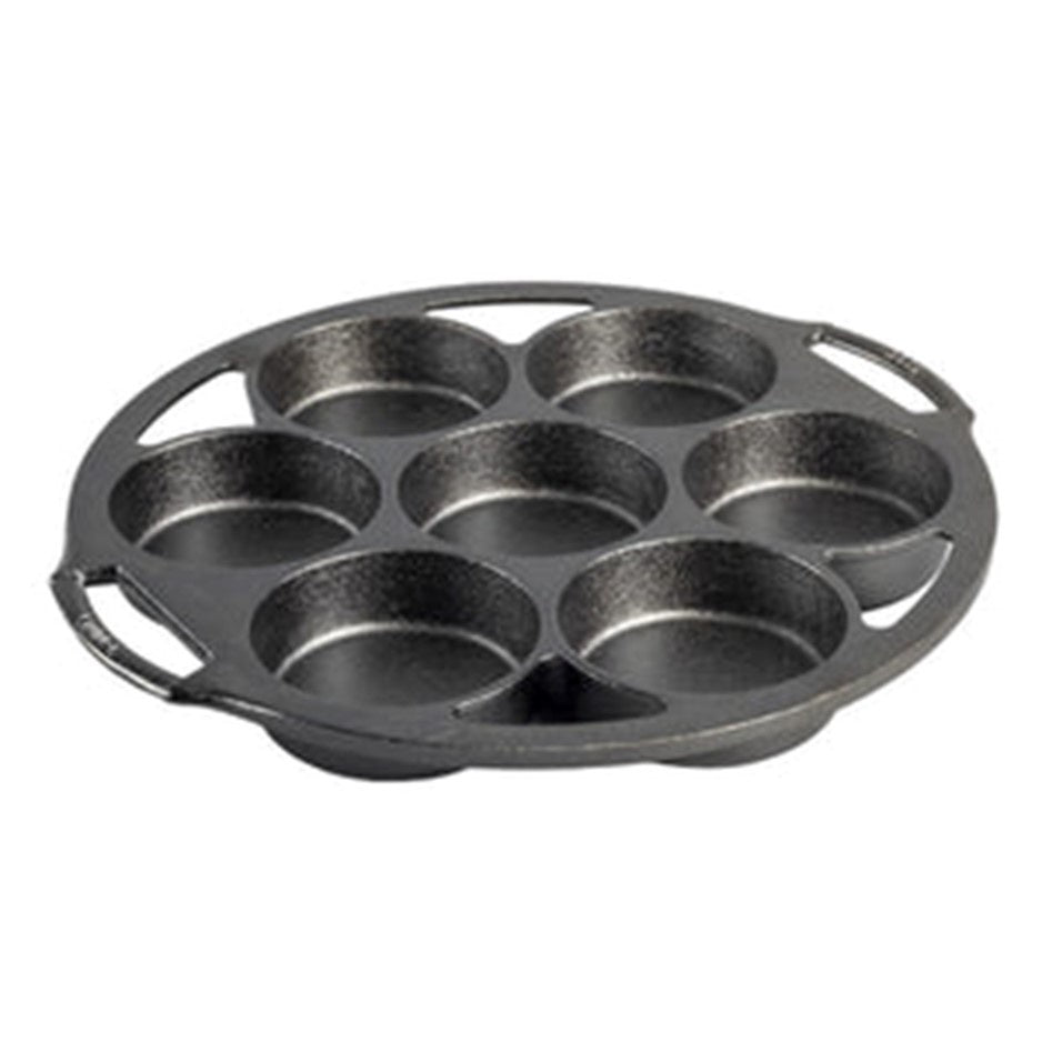Lodge cast iron mini cake pan in black with seven round cavities and two side handles