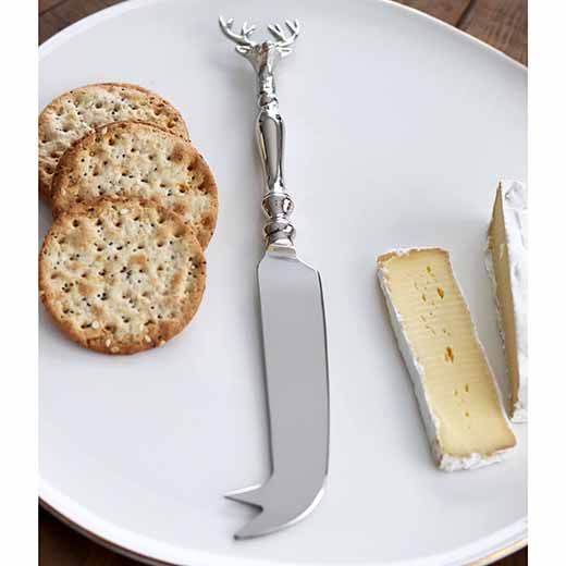 Old Mill Road elk cheese knife with an elk head handle, shown on a plate with crackers and brie