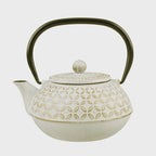Teaology 900ml cast iron teapot in white and gold with a geometric pattern and a black handle