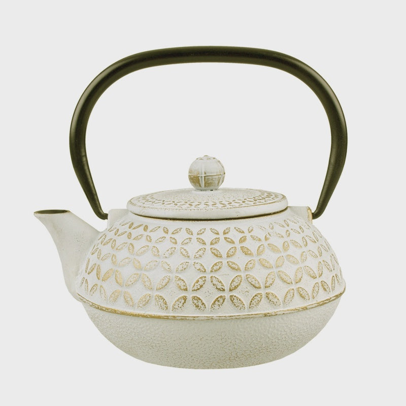 Teaology 900ml cast iron teapot in white and gold with a geometric pattern and a black handle