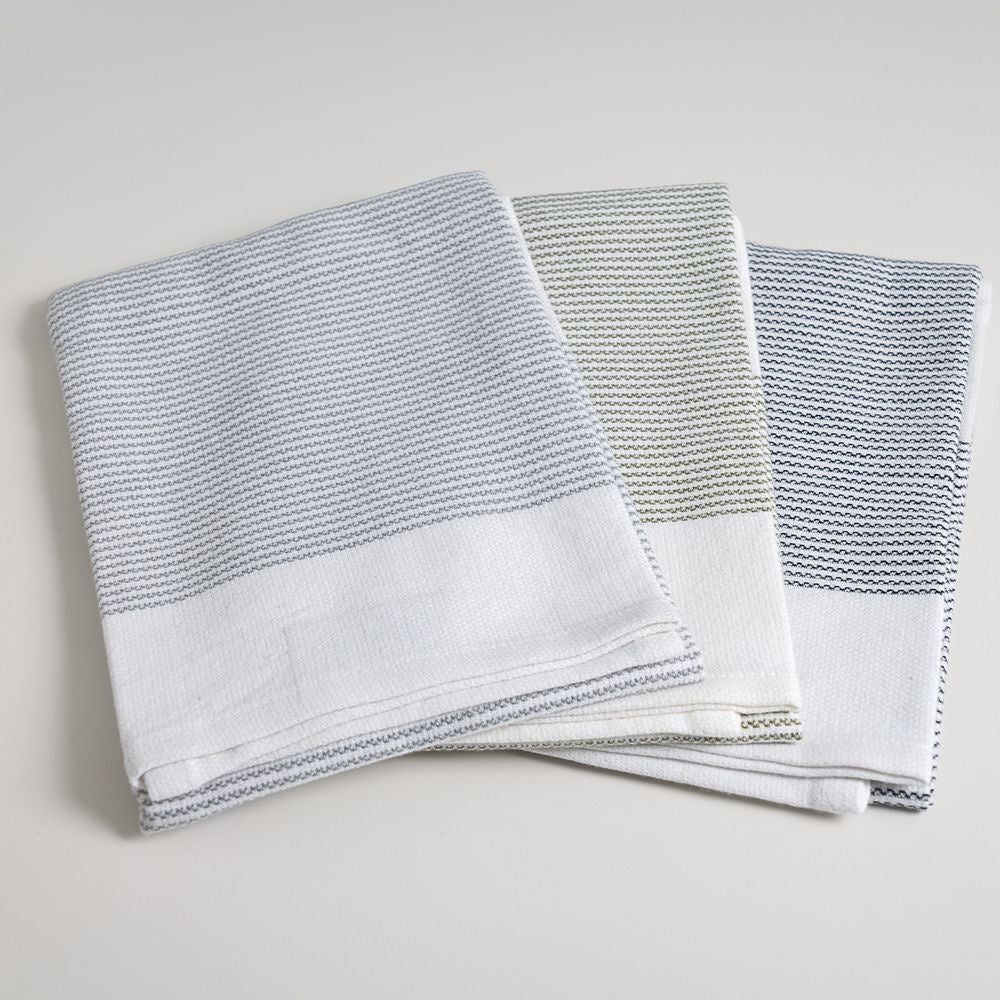Baksana Thirsty tea towels in smoke, olive and ash stripes, a set of three folded