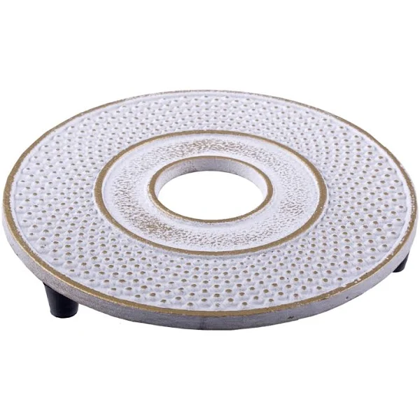 Teaology Fine Hobnail cast iron trivet in white with a gold textured pattern