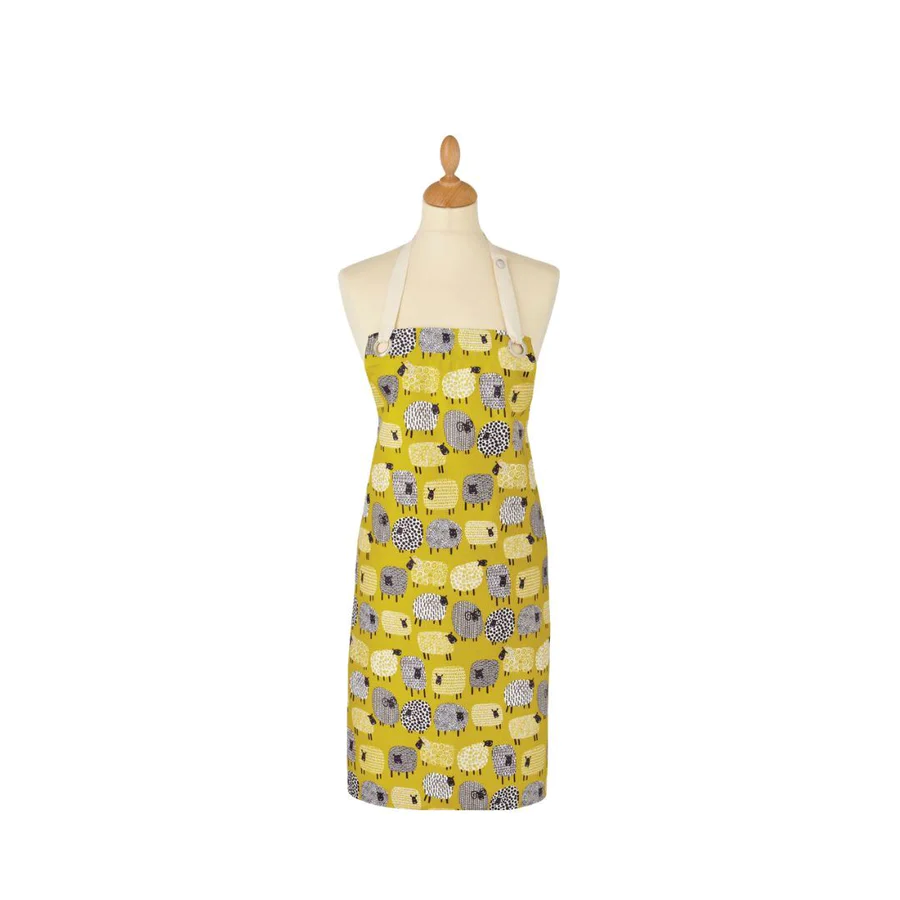 Ulster Weavers oil cloth apron with a Dotty Sheep print in mustard yellow, shown on a dress form