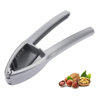 Westmark nutcracker in silver with curved handles, shown with mixed nuts