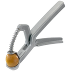 Westmark olive stoner, a grey metal hand-squeeze tool pitting a green olive
