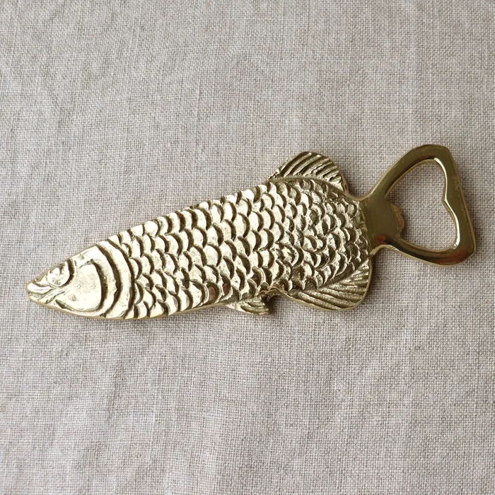 Old Mill Road fish bottle opener in brass with an embossed scale pattern