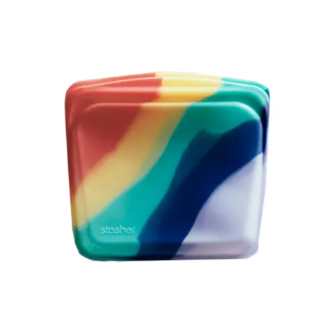 Stasher reusable silicone sandwich bag in a rainbow ombre of red, yellow, teal and purple