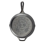 Lodge Sugar Skull skillet in black cast iron with an embossed skull design
