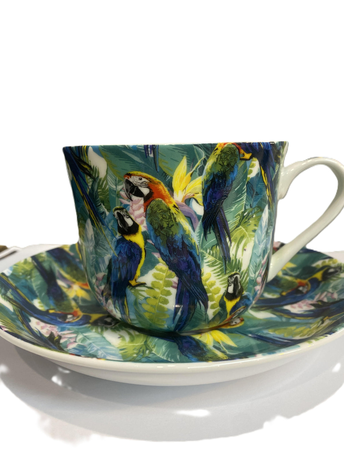 Heritage breakfast cup and saucer with a Tropical Birds pattern of parrots and jungle leaves