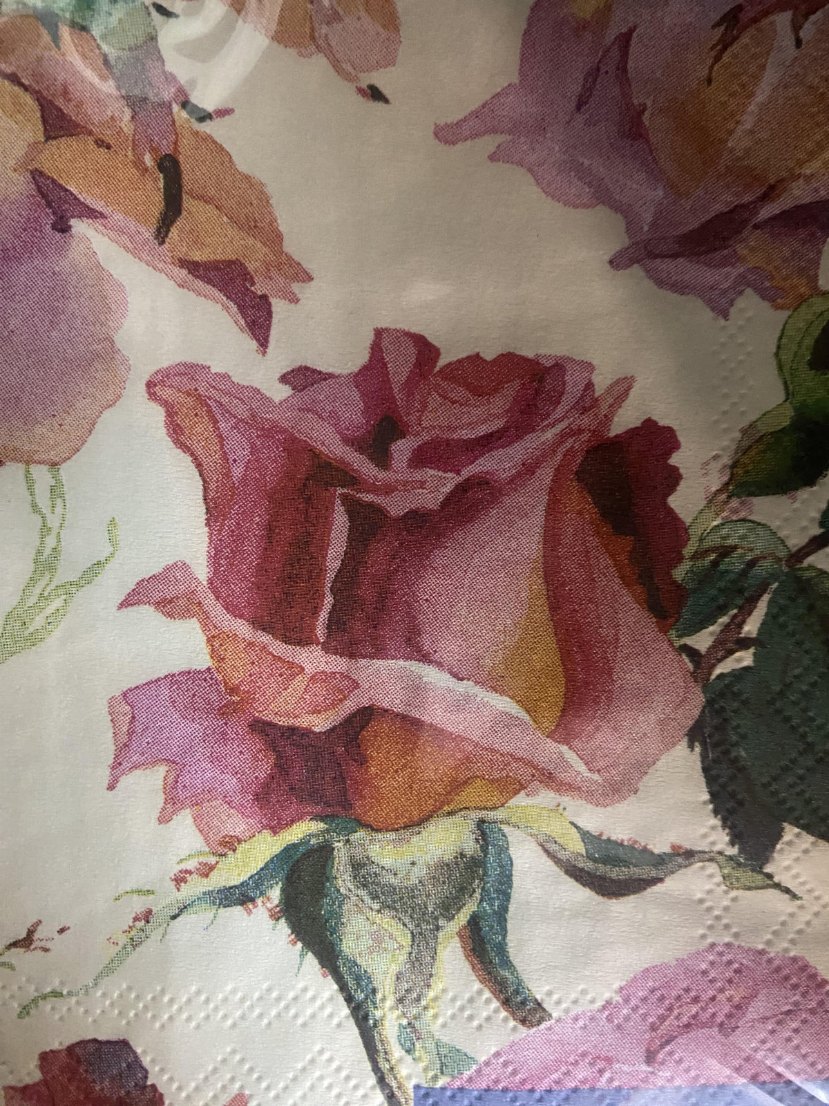 IHR cocktail napkin printed with large pink and cream roses, in the Emma Bridgewater style